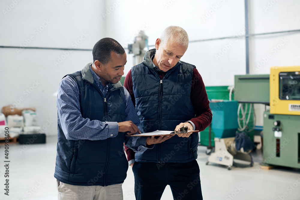 Supervising operations has never been easier. Shot of two factory managers doing a warehouse inspection. Supervising operations has never been easier. Shot of two factory managers doing a warehouse inspection.
