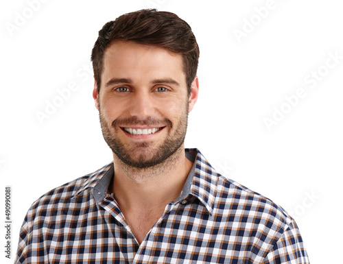 Casual and content. Studio portrait of a handsome young man smiling isolated on white.