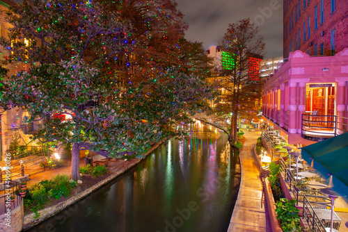 San Antonio River Walk at E Crockett Street at night in downtown San Antonio, Texas, USA.