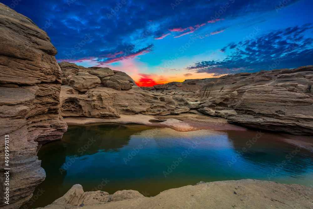 Grand canyon,Ubon Ratchathani,Scenery of Eroded large rocky rapids gorge with Mekong river and colorful sky in the sunset