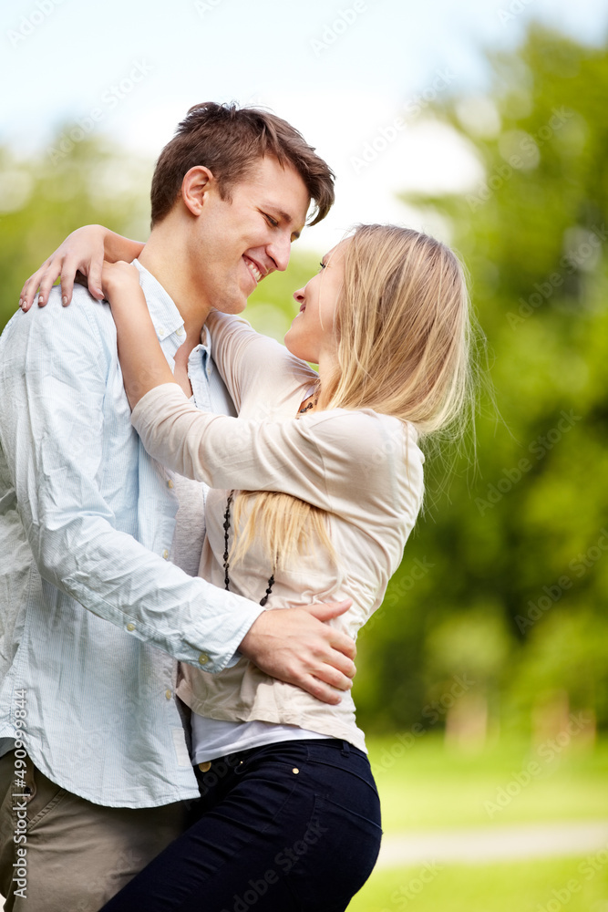 Having fun together. Young couple standing together in the park. Having fun together. Young couple standing together in the park.