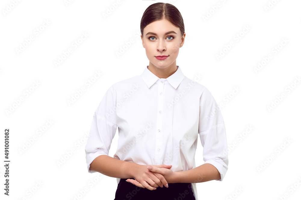 Young beautiful sexy woman in a white shirt on a white isolated background with beautiful makeup and styling folded her hands Young beautiful sexy woman in a white shirt on a white isolated background with beautiful makeup and styling folded her hands