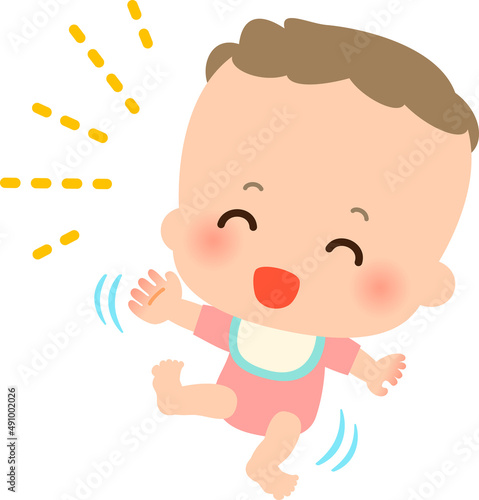 笑って手足をバタつかせる赤ちゃん