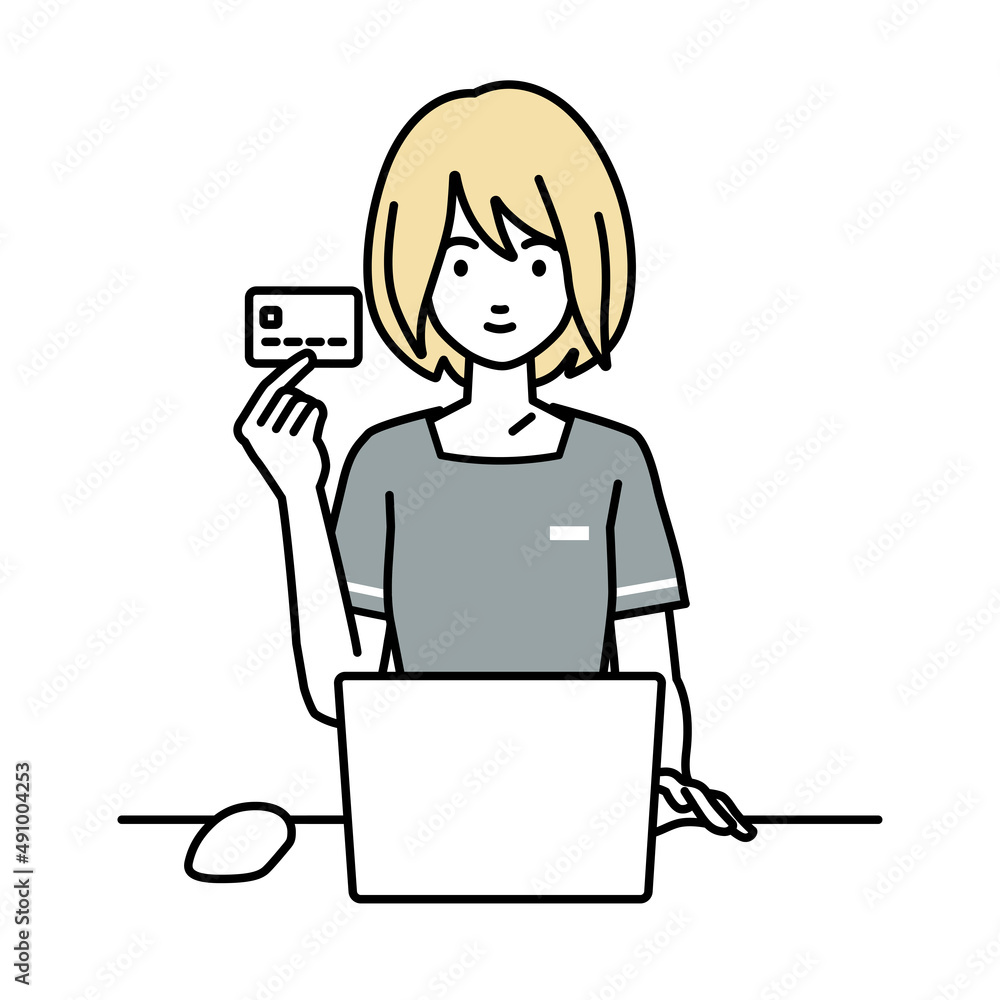 デスクで座ってPCを使いながらクレジットカードを手に持っているエステ店員の女性 デスクで座ってPCを使いながらクレジットカードを手に持っているエステ店員の女性