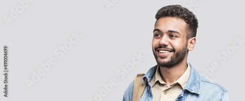 Closeup portrait of handsome smiling young man. Laughing joyful cheerful men isolated studio shot. Panoramic banner