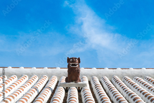 Shisa symbol of Okinawa Lion on original Ryukyu architecture roof art Okinawa island Japan