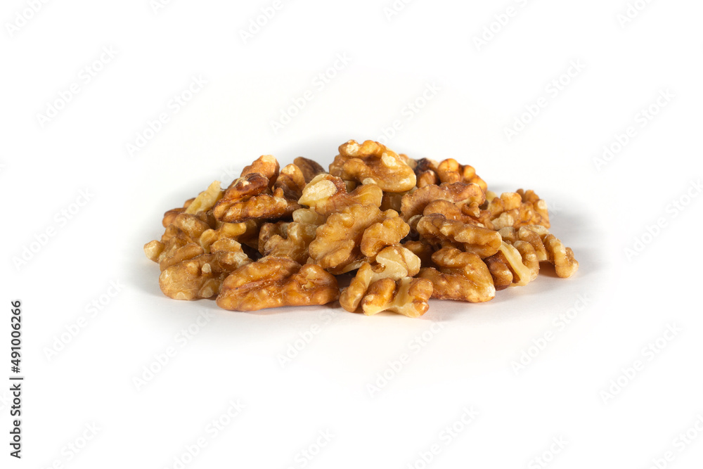 Walnuts in Pile or Heap of Halves and Pieces Isolated on White in Point of View Shot Walnuts in Pile or Heap of Halves and Pieces Isolated on White in Point of View Shot
