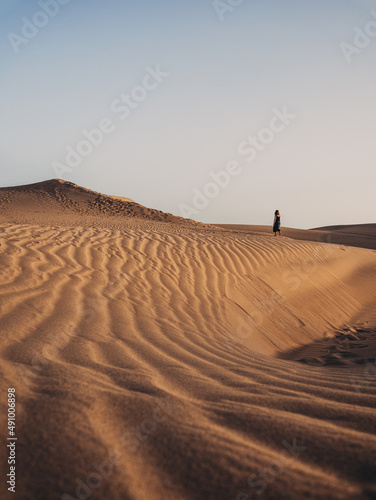 Girl exploring some sand dunes