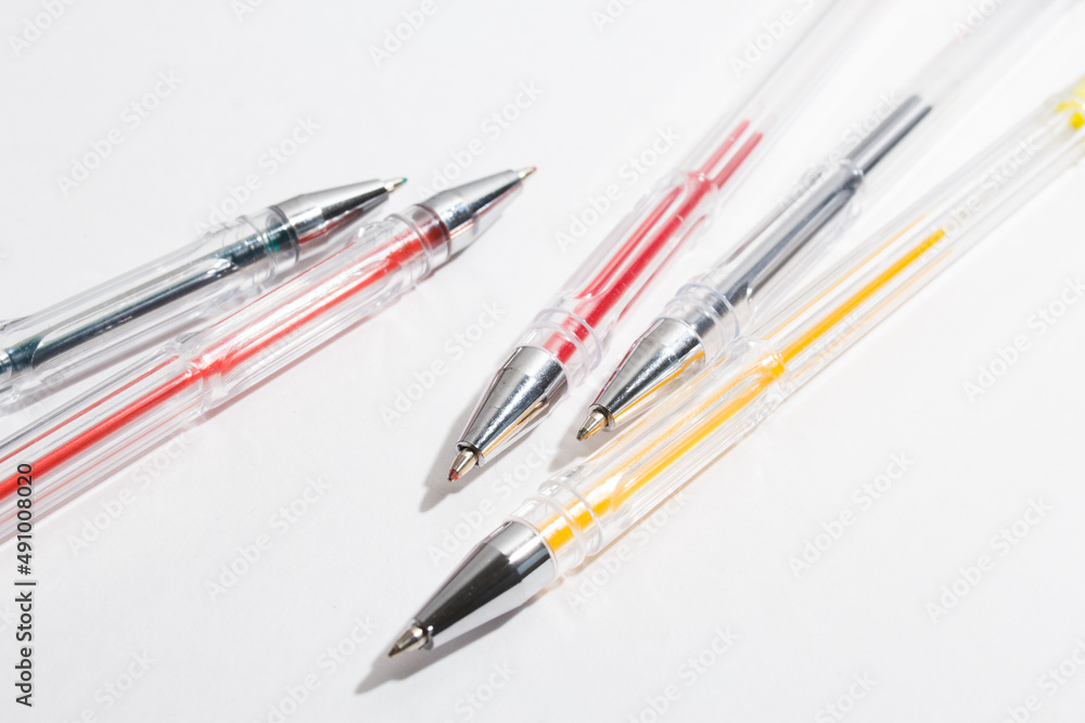 colored gel pens for writing on a white background