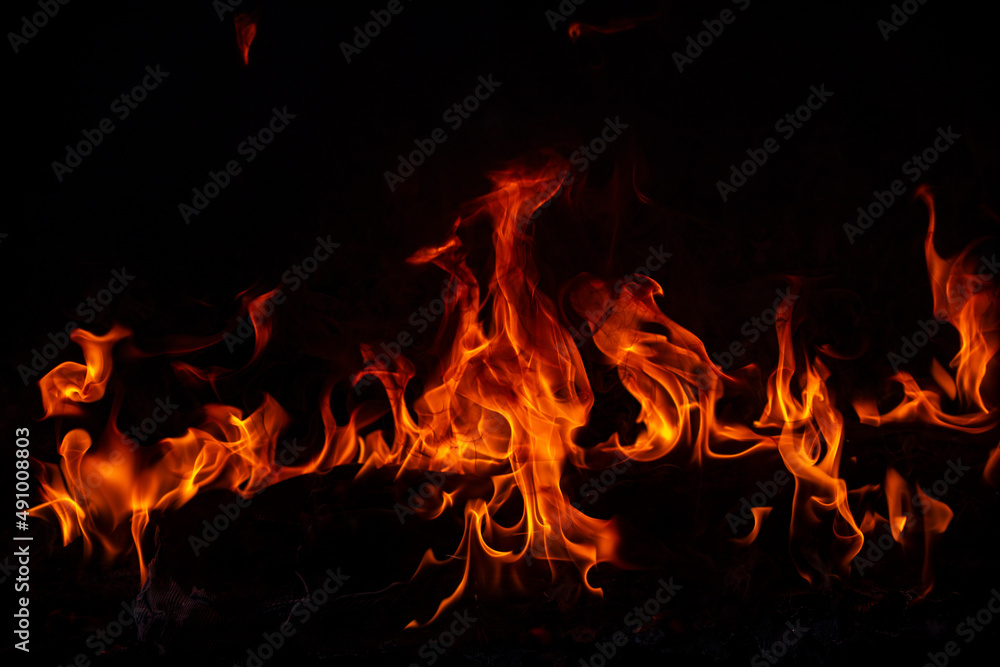 Fire blaze flames on black background. Fire burn flame isolated, abstract texture. Flaming explosion effect with burning fire. Fire blaze flames on black background. Fire burn flame isolated, abstract texture. Flaming explosion effect with burning fire.