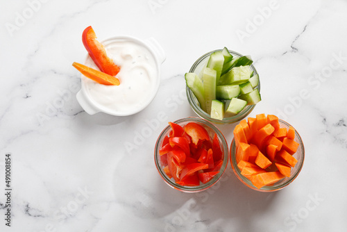 Fresh vegetable sticks. Snack for diet. Top view. Carrot, cucumber and bell pepper.