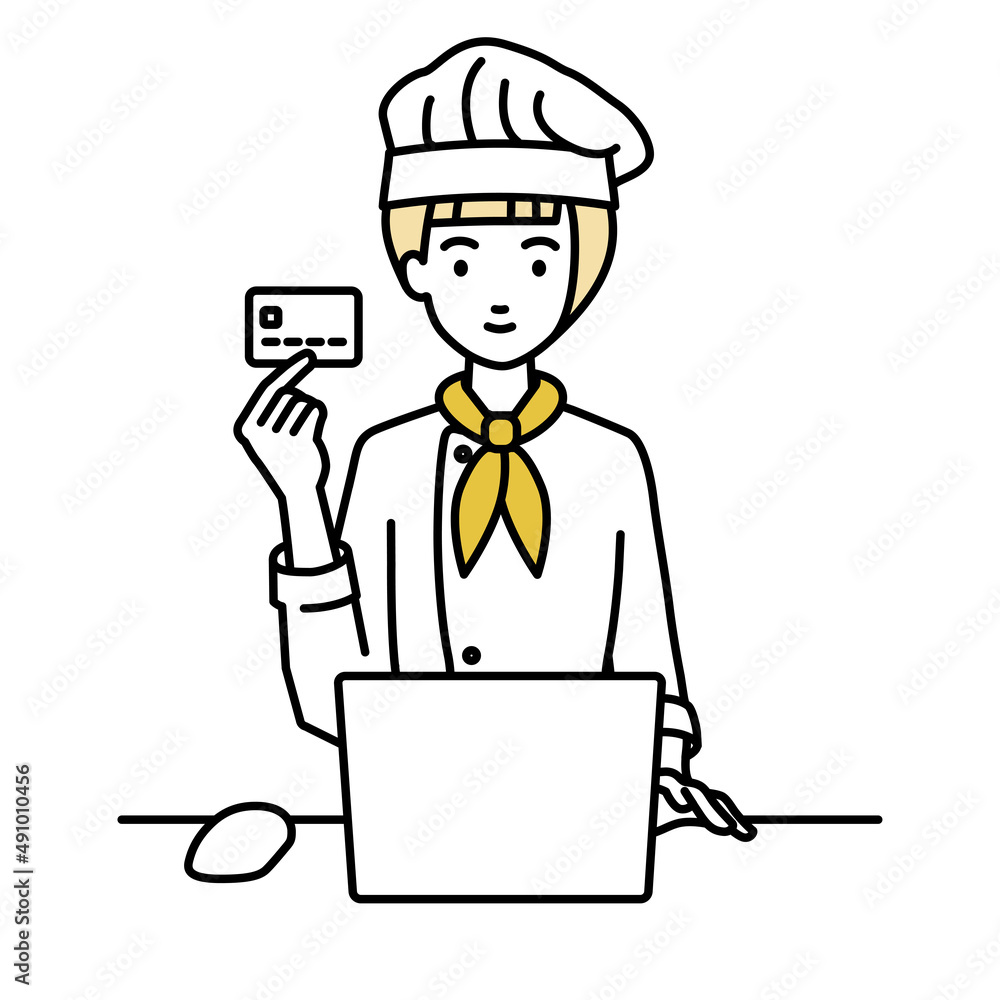 デスクで座ってPCを使いながらクレジットカードを手に持っている調理師の女性