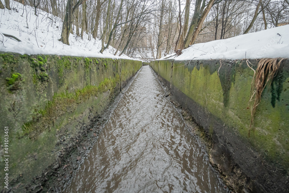 Fototapeta premium Drainage ditch collector for drainage of surface and flood water and snow.