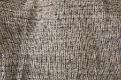 Close up texture of grey knitted fabric cloth