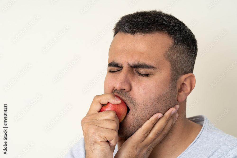 Close up photo of man with toothache or teeth pain. Concept of oral or dental care. selective focus Close up photo of man with toothache or teeth pain. Concept of oral or dental care. selective focus