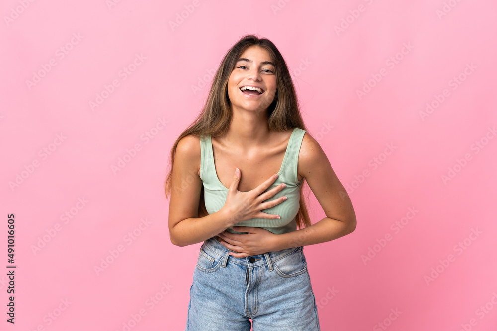 Young caucasian woman isolated on pink background smiling a lot Young caucasian woman isolated on pink background smiling a lot