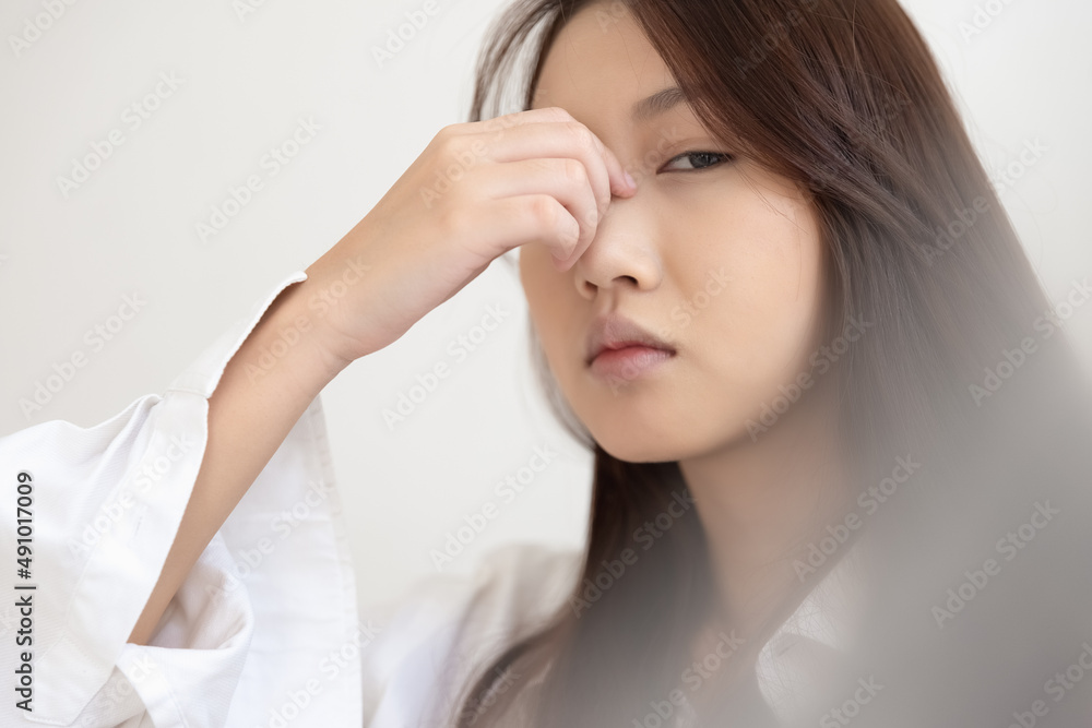 Asian woman feeling sick have a headache, coughing because of Coronavirus Covid-19. Protection and recovery from the illness quarantine at home, Stay at home. Asian woman feeling sick have a headache, coughing because of Coronavirus Covid-19. Protection and recovery from the illness quarantine at home, Stay at home.