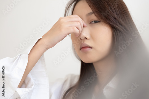 Asian woman feeling sick have a headache, coughing because of Coronavirus Covid-19. Protection and recovery from the illness quarantine at home, Stay at home.