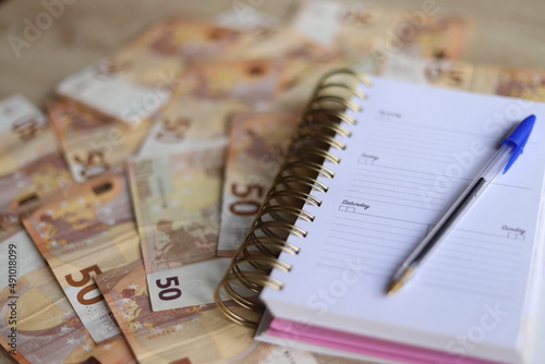 Organize finances with planner/journal.  photo