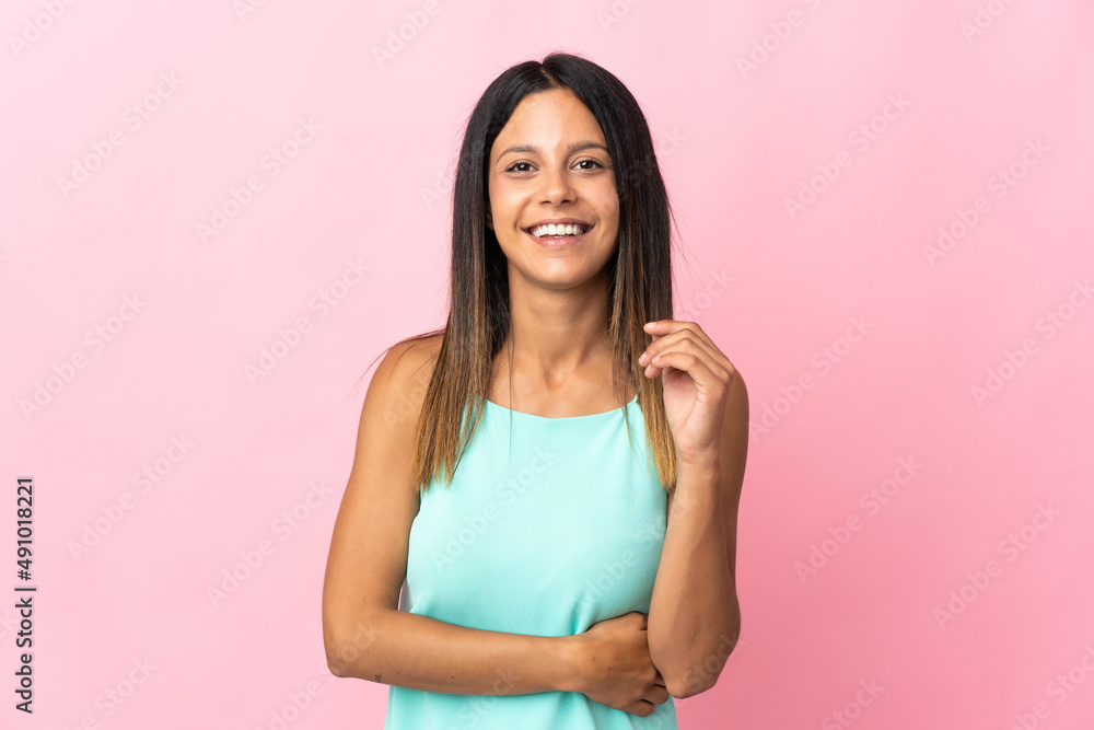 Fototapeta premium Caucasian girl isolated on pink background laughing