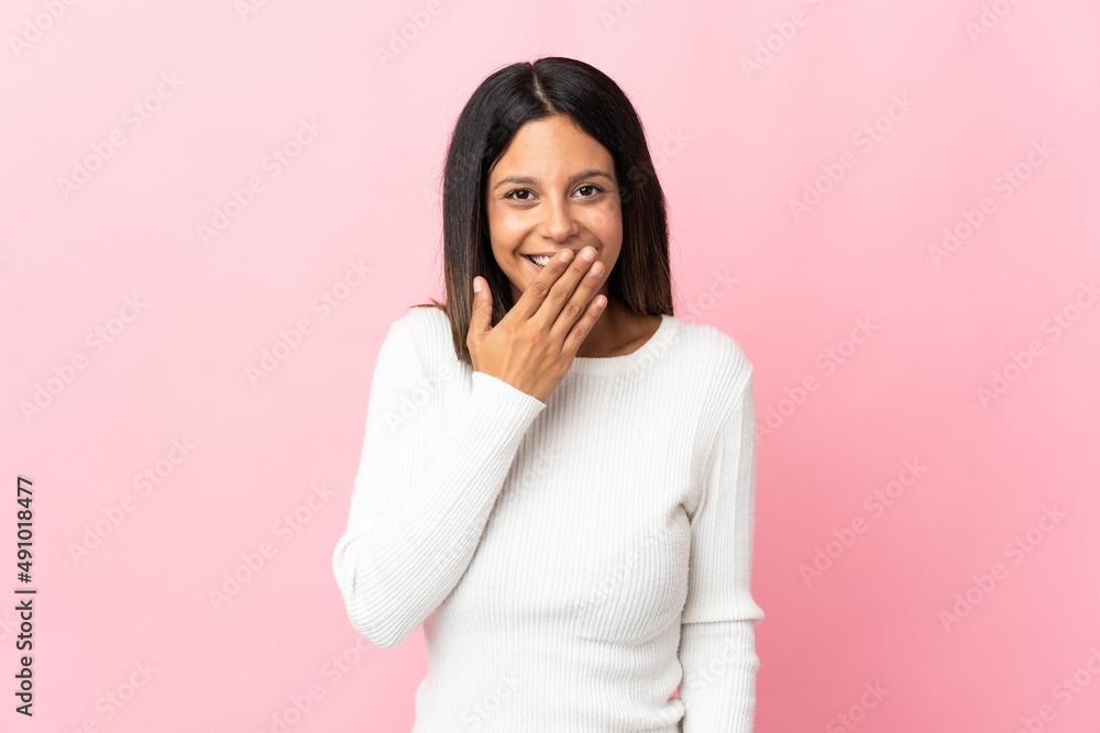 Caucasian girl isolated on pink background happy and smiling covering mouth with hand Caucasian girl isolated on pink background happy and smiling covering mouth with hand