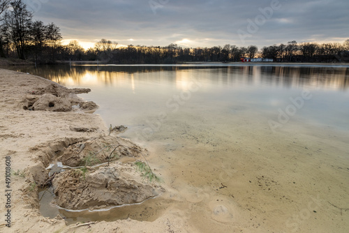 Evening mood with reflections on the beach at Silbersee  Germany  Lower Saxony  Hanover  Langenhagen