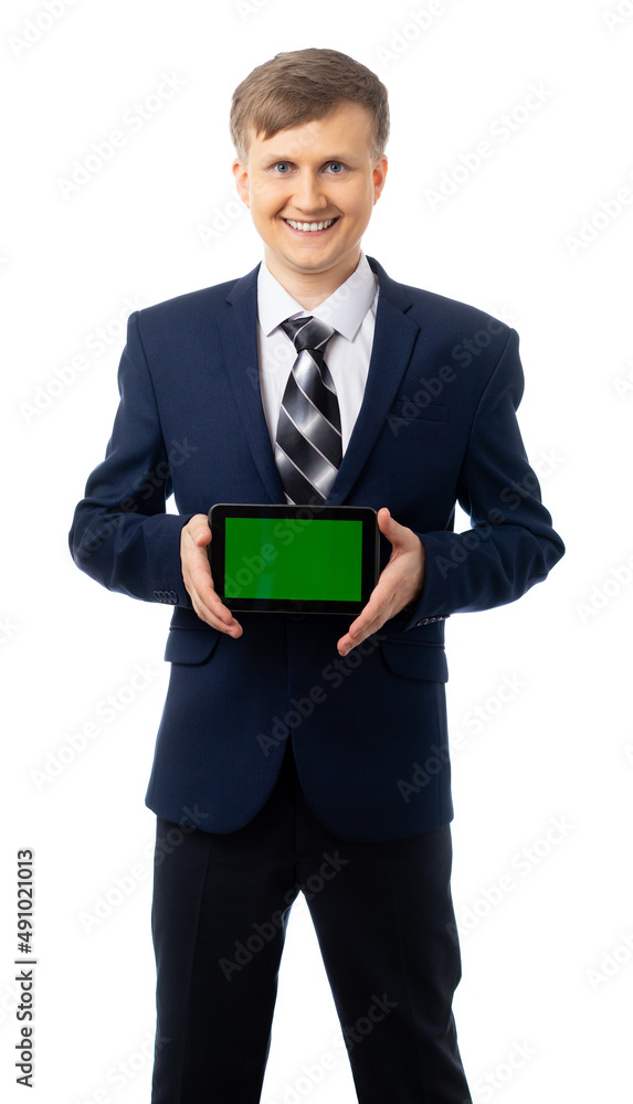 Portrait of a happy man in a blue business suit. A successful businessman smiles, looks at the camera and holds the tablet in front of him horizontally. place for an inscription. White background. Portrait of a happy man in a blue business suit. A successful businessman smiles, looks at the camera and holds the tablet in front of him horizontally. place for an inscription. White background.
