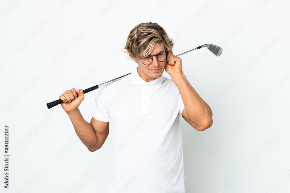 English man playing golf frustrated and covering ears English man playing golf frustrated and covering ears