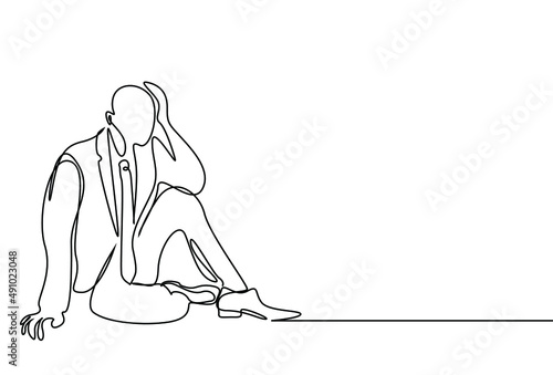 businessman sitting on the floor sadly