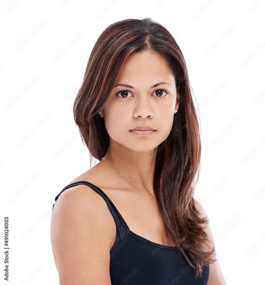 Shes a no-nonsense woman. Studio portrait of a beautiful young woman with a serious facial expression. Shes a no-nonsense woman. Studio portrait of a beautiful young woman with a serious facial expression.