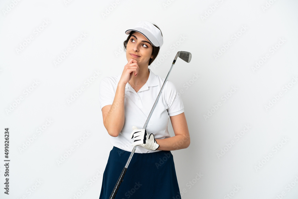 Handsome young golfer player woman isolated on white background and looking up Handsome young golfer player woman isolated on white background and looking up