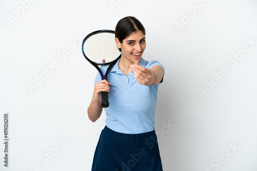 Handsome young tennis player caucasian woman isolated on white background making money gesture