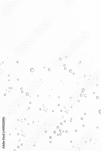 Fizzing air bubbles on white background. Fizzy water background, abstract bubbles.