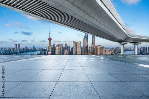 Empty square floor and city skyline with buildings in Shanghai, China.