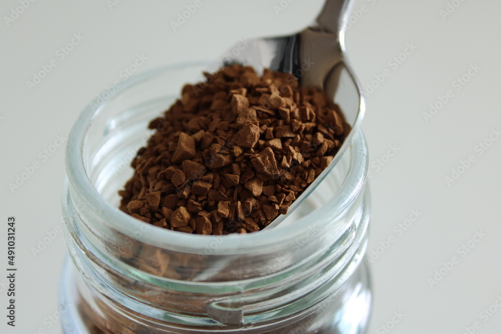 Granular instant coffee in the spoon Granular instant coffee in the spoon