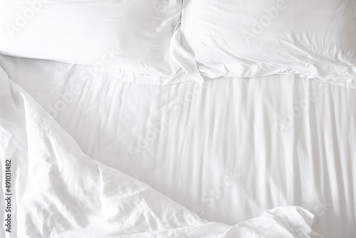 Mattress and white pillows in the bedroom with copy space.