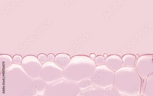 Beauty pink texture cosmetic make-up remover or serum bubbles texture background