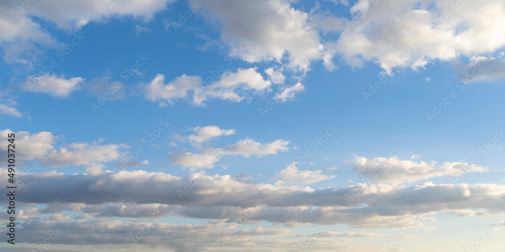 Beautiful vivid blue sky with summer clouds background	
