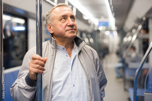 Middle aged man in subway car