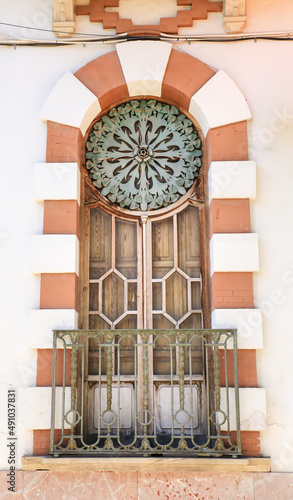 Art nouveau style window with forged metal details