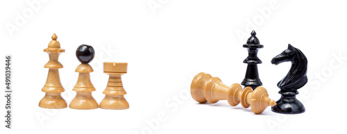 Old chess pieces isolated on white background