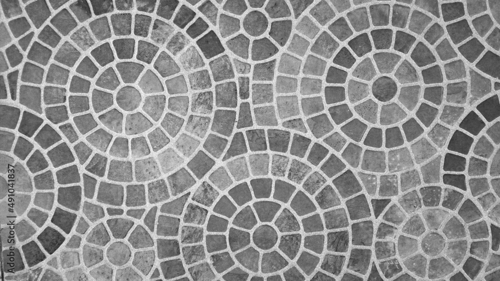 black Tile or ceramic floors are arranged in a mosaic pattern.
