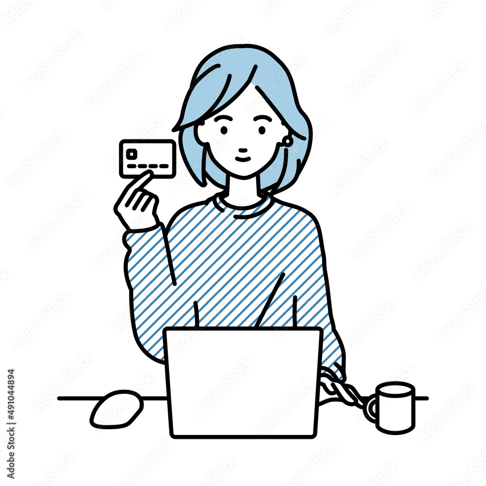 デスクで座ってPCを使いながらクレジットカードを手に持っているリモートワークの女性 デスクで座ってPCを使いながらクレジットカードを手に持っているリモートワークの女性