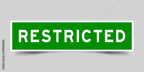 Square label banner with word restricted in green color on gray background