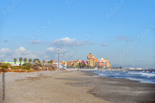 Coastline Alboraya beach with colourful house in Port Saplaya, Valencia, Spain. "Little Venice" in Mediterranean Sea. Travel on touristic famous and popular Beaches of Valencia with unique landscape.