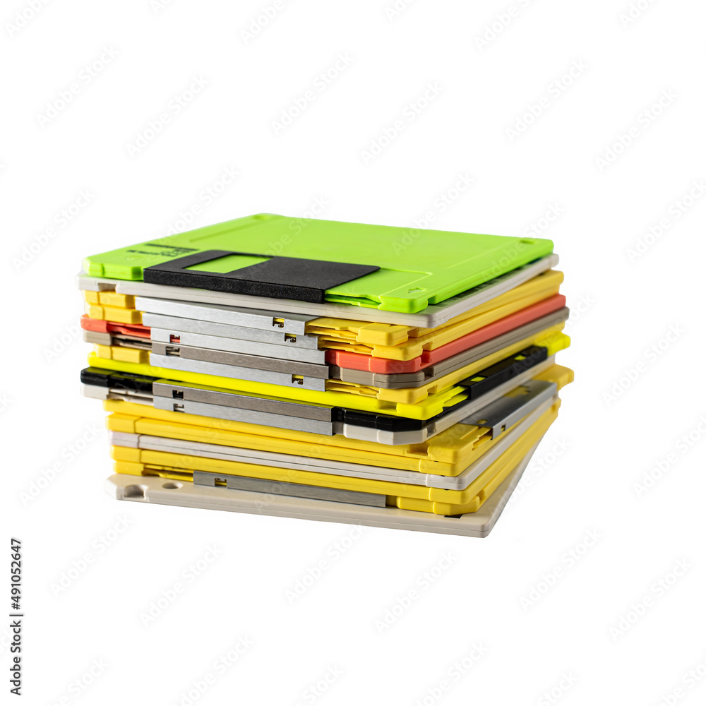 stack of multi-colored diskettes on white background. Colored floppy disks.