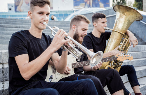 Canvas Print Young street music band play a lot of musical instruments