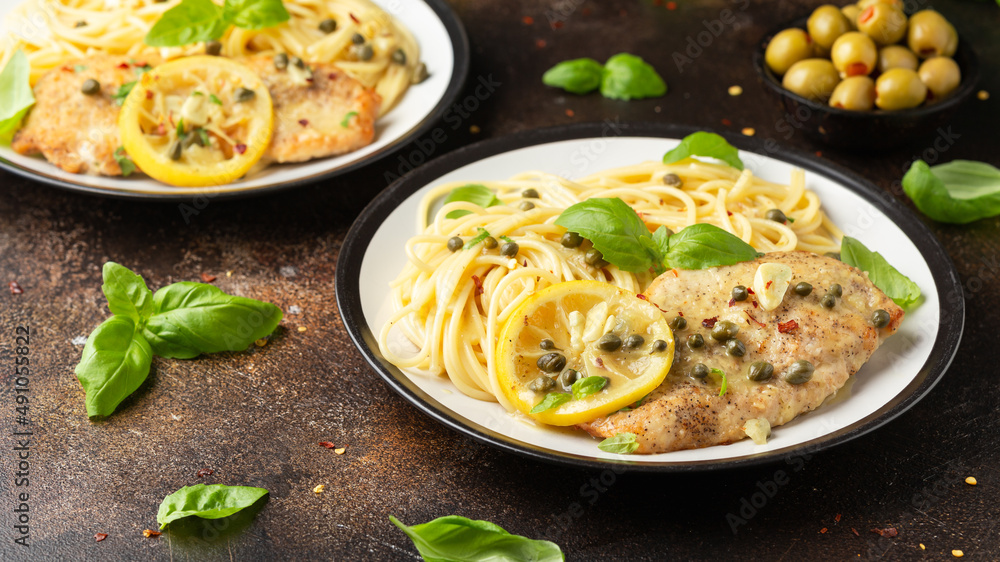 Chicken Piccata with capers, white wine sauce and spaghetti. Italian food Chicken Piccata with capers, white wine sauce and spaghetti. Italian food