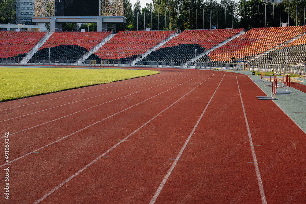 Running tracks close-up at the stadium during sunset. Sports facilities for running. Sport.