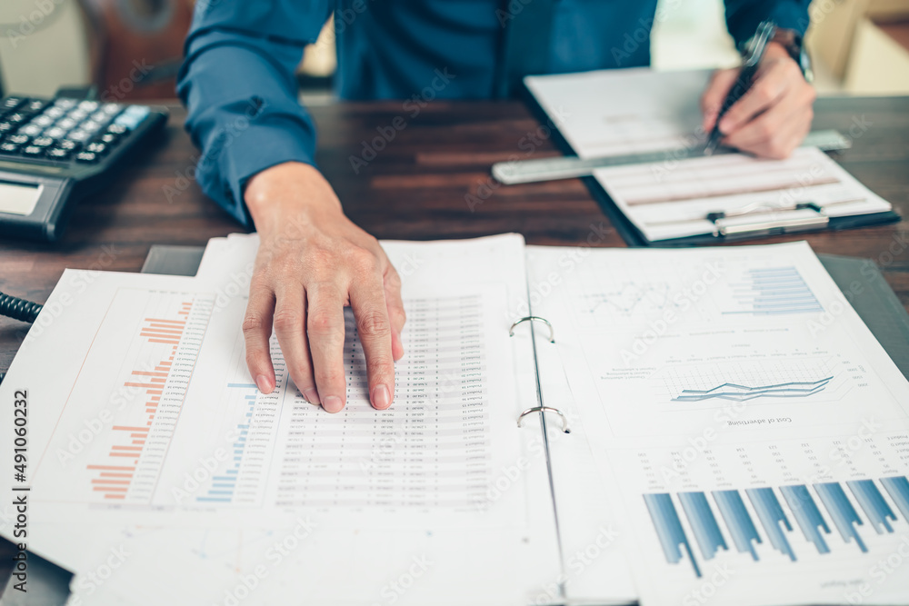 Businessman working on office desk and analyzing new project of accounting finance. Investment, Financial advisor, budget, plan and accounting concept. Businessman working on office desk and analyzing new project of accounting finance. Investment, Financial advisor, budget, plan and accounting concept.